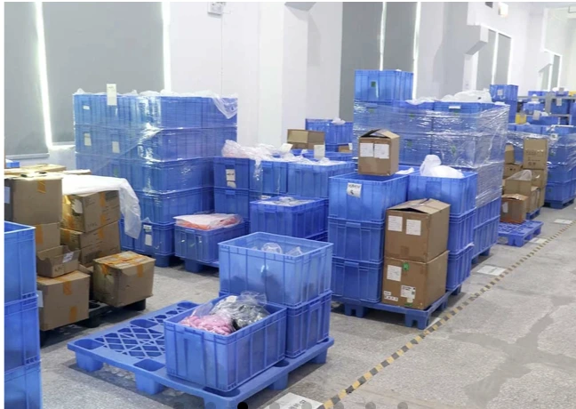 Production materials and cartons staged in a factory facility